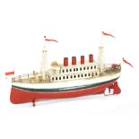 A Carette four funnel liner with twin deck painted in cream with red and black hull, length 30cm,