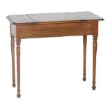 An early 20th Century oak writing desk with canted corners,