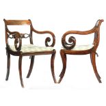 A pair of late Regency simulated rosewood and rosewood veneered elbow chairs,