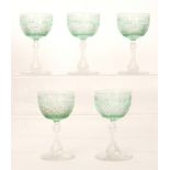 A set of five late 19th Century wine glasses with an ovoid bowl engraved with a floral garland over