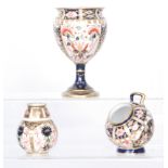 Three pieces of Royal Crown Derby Imari comprising a pedestal vase in 6299,