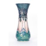 AMENDMENT - A Moorcroft Pottery vase of slender waisted form decorated in the Cluny pattern