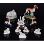 A collection of 19th Century Staffordshire figures to include three encrusted models of sheep,