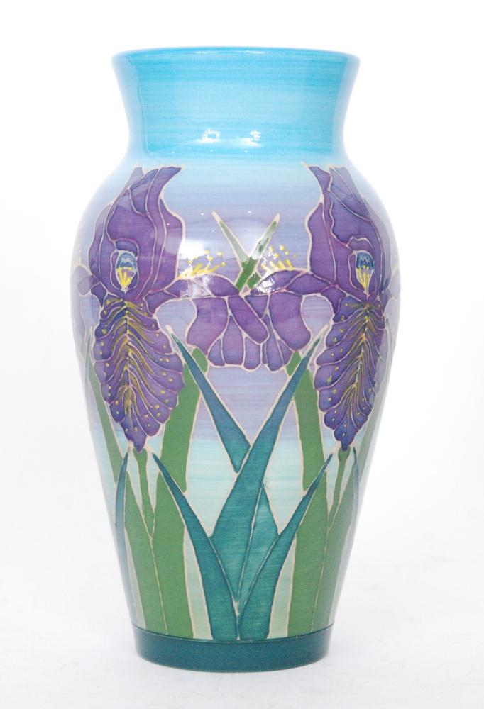 A Dennis China Works vase decorated with tubelined purple iris against a tonal blue and purple