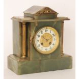 An Edwardian onyx mantle clock of classical form with eight day striking movement on a gong,