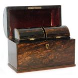 A 19th Century coromandel tea caddy the domed top opening to reveal two divisions each with covers