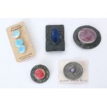 A set of three Ruskin Pottery carded light blue souffle glaze buttons,