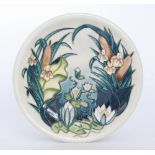 A Moorcroft Pottery plate decorated in the Lamia pattern designed by Rachel Bishop,