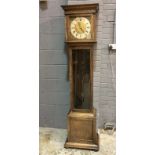 A 20th Century oak longcase clock with 30 hour striking movement brass dial and silver chapter ring
