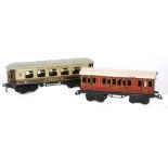 A Bing O gauge pullman Plato corridor coach in cream and brown livery and a LMS white and maroon