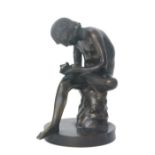 After the Antique a bronze classic figure of Spinario removing a thorn from his foot,