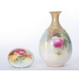 A small Royal Worcester 'Hadley's Roses' bud vase decorated with hand painted pink and crimson