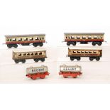 Two Marx O gauge corridor coaches in red and cream livery,