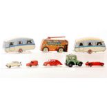 A Marx tinplate clockwork tank, a red sedan car, two caravans, a Wells Brimtoy transport bus,