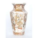 A late 19th Century Japanese Satsuma vase of hexagonal form decorated with scenes of robed figures