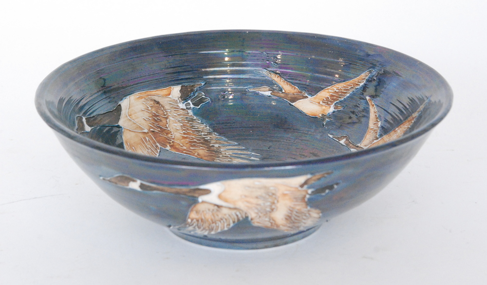 A contemporary pottery bowl by Lisa B Moorcroft decorated with tubelined geese in flight over a - Image 2 of 2