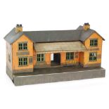 A Bing O gauge tinplate station with lithograph advertising for 'Drink Liptons Tea,