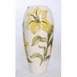 A large Moorcroft Pottery vase decorated in the Bermuda Lily pattern with large yellow flowers