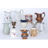 A collection of assorted 19th Century Staffordshire mugs and jugs to include copper lustre examples,