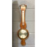 A 20th Century aneroid barometer, silvered register marked Comitti,