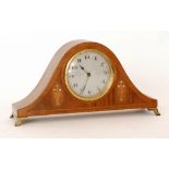 An early 20th Century inlaid mahogany mantle clock on brass feet,