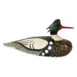 Danny Clewett - A carved wooden decoy duck with painted finish , signed and dated to the base 1992,