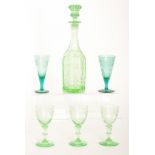 A late 19th Century pressed glass decanter of bottle form with Gothic style decoration to the