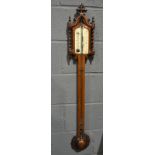 A 19th Century carved walnut Gothic barometer, the scale inscribed Mark Hill, Birmingham,