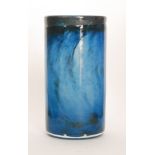 A mid 20th Century Kosta Boda glass vase of cylindrical form with tonal blue swirled and mottled