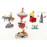 A Chinese replica clockwork tinplate clown and donkey, a field gun and operator,