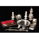 A small parcel lot of assorted silver items to include a small waiter, mustard pot,