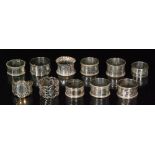 Eleven assorted hallmarked silver napkin rings to include circular and hexagonal examples,