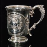 A Victorian hallmarked silver pedestal christening cup decorated with a Classical maiden riding a