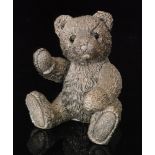 A contemporary hallmarked silver model of a seated teddy bear, height 10cm, Birmingham 1996,