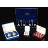 A cased set of six hallmarked silver tea spoons and tongs, with a cased set of bridge pencils,