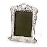 An Edwardian hallmarked silver rectangular easel photograph frame with embossed iris decorations,