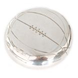 A hallmarked silver cushioned spring loaded circular tobacco box modelled as a football,