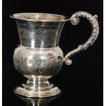 A hallmarked silver pedestal christening cup with foliate engraved decoration and acanthus capped