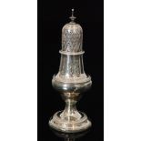 A George III hallmarked silver castor of plain baluster form detailed with gadroon border below