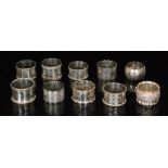 Ten assorted hallmarked silver napkin rings to include circular and hexagonal examples,