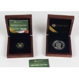 Two Michael Collins Commemorative Medallions, one silver and one gold, issued 2012.