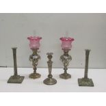 Two Oil Lamps, with ruby glass shades, with a collection of seven Candlesticks, as a lot.
