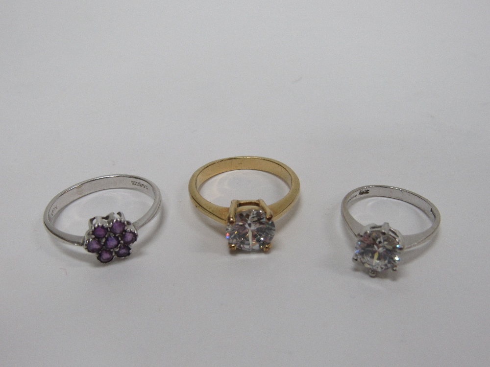 An attractive 14k white gold Ring, set with a floral design amethyst stone,