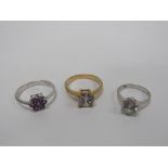 An attractive 14k white gold Ring, set with a floral design amethyst stone,