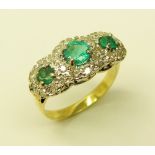 An attractive three stone emerald Ring,