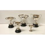 Five varied two handled silver Trophy Cups, various sizes, mostly Dublin c.