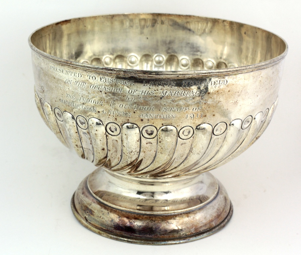 A very large silver Punch Bowl, with reeded swirl body, a tall circular foot, Birmingham c.