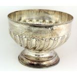 A very large silver Punch Bowl, with reeded swirl body, a tall circular foot, Birmingham c.