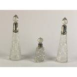 A small pair of silver mounted cone shaped cutglass Decanters & Stoppers;