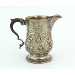 An attractive embossed late 18th Century English Cream Jug, London c. 1794, maker possibly G.G.